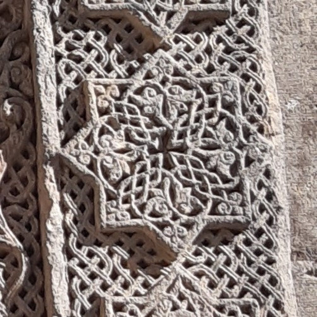 Goshavanq Octagon Pendant Crafted from Poghos Varbed Khachkar Stone - looping vine-like motifs